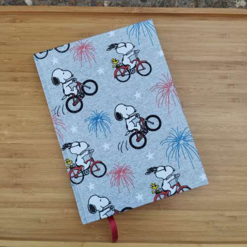 Cuaderno Snoopy en bicicleta